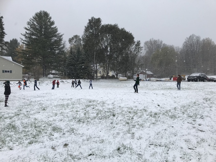 students playing in the snow